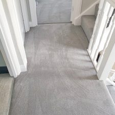 An upstairs landing fitted with a polypropylene bleach cleanable, fade resistant domestic carpet.