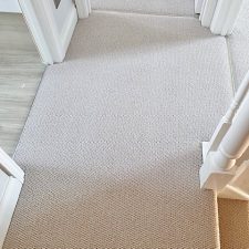 View of a hallway floor which is fitted with a 100% New Zealand Wool light grey heavy domestic carpet.
