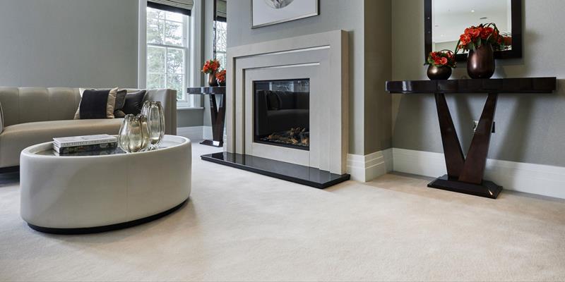 A stylish living room with neutral decor and a pure wool carpet by Westex Carpets.