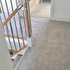 View of landing fitted with grey twist pile carpet.