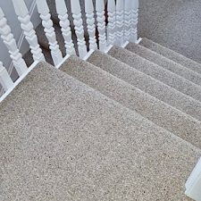 View down stairs fitted with berber heavy domestic carpet