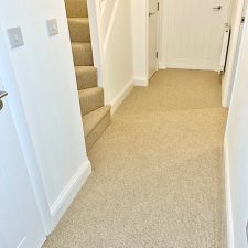 Hallway fitted with a beige wool loop 2 ply yarn, moth resistant carpet