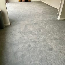 A living room fitted with a grey polypropylene twist pile carpet