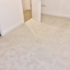 View of a bedroom fitted with a polypropylene twist, 2 ply nylon carpet.