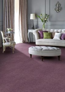 Formal sitting room with pale grey sofa and footstall, deep grey walls and deep mauve carpet from the Colorado range by Penthouse Carpets.