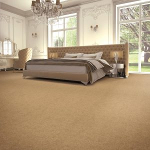 Bedroom overlooking a garden with large bed and mid brown carpet from the Esprit Nouveau range by Penthouse Carpets.