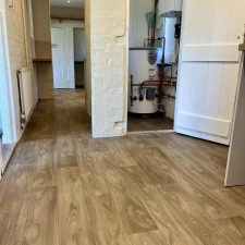 View of a kitchen with 2.8mm thick vinyl flooring in an oak shade.