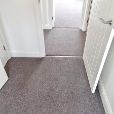 View of a bedroom doorway and landing fitted with an 80% wool, 20% synthetic mixture twist carpet