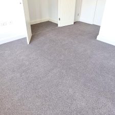 View of a bedroom fitted with an 80% wool, 20% synthetic mixture twist carpet