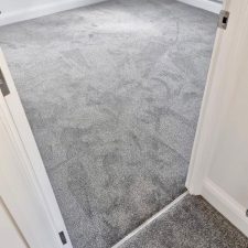 View of a bedroom in a new build fitted with a mid grey polypropylene twist, bleach cleanable, fade resistant and moth proof carpet.