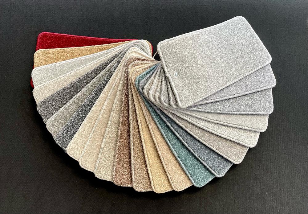 A sample pack of Cormar Carpets' Apollo Plus range, fanned out so you can see all the different colours available.