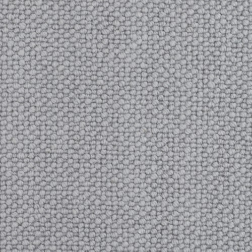 Closeup of grey carpet showing the circular pile design for the Habberley classic pattern.