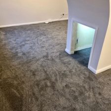View of a room with cubby hole and fitted with a grey 100% polypropylene Saxony carpet.