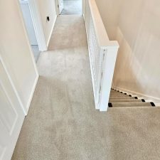A landing fitted with a twist carpet in a light grey-beige colour.